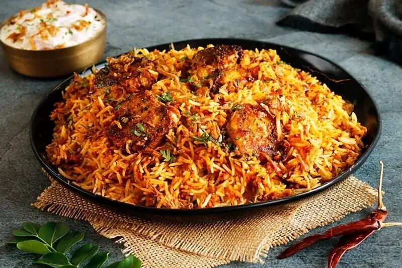 A flavorful mixed rice dish made with aromatic spices, basmati rice, and marinated meat. A flavorful mixed rice dish made with aromatic spices, basmati rice, and marinated meat.